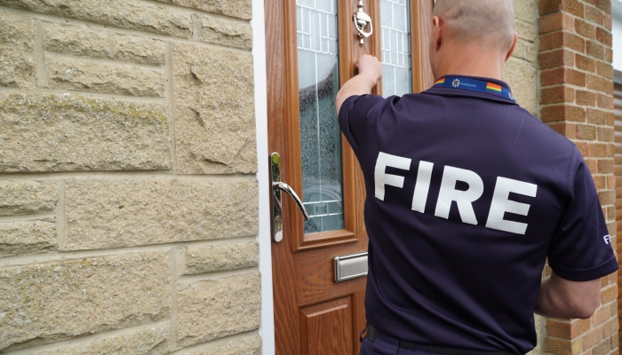 Firefighter knocking on door