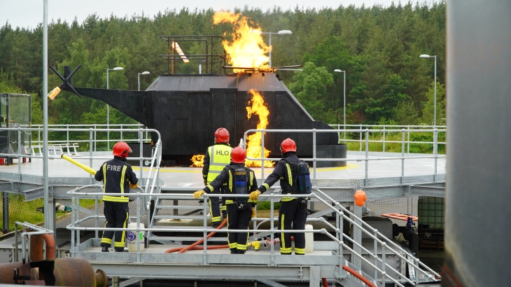 Firefighters tackle a simulated helicopter fire at the new CDDFRS facility in Bowburn. 