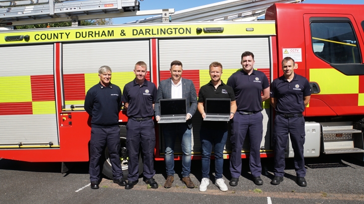  Protech City bosses with Peterlee Firefighters in front of fire engine. 