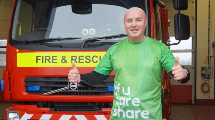 Durham Crew Manager Paul Bainbridge standing in front of a fire engine. 