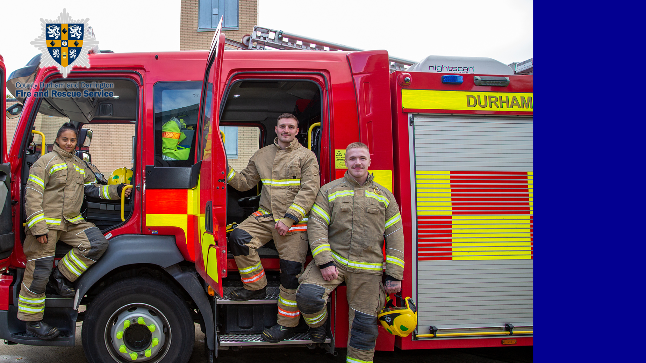 3 Firefighters stood on Firetruck