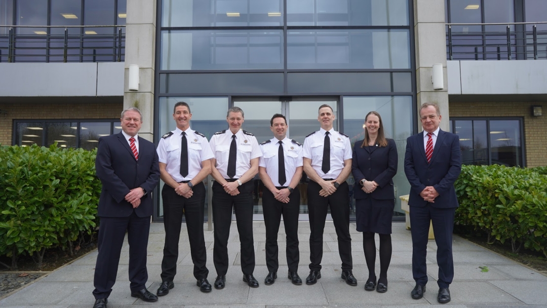 The Senior Leadership Team standing outside of HQ.